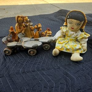 Corn husk dolls, old roller skate, old doll